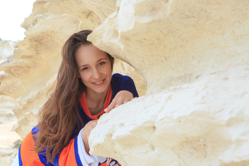 Cute Megan Muse Clambers About On The Rocks In A Giant Sports Shirt That Dwarfs Her Petite Frame